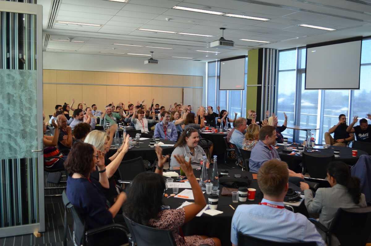 Audience attending conference voting for the Great Debate